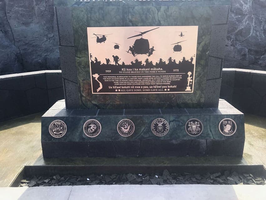 War Memorial plaque with helicopter silhouettes and service seals