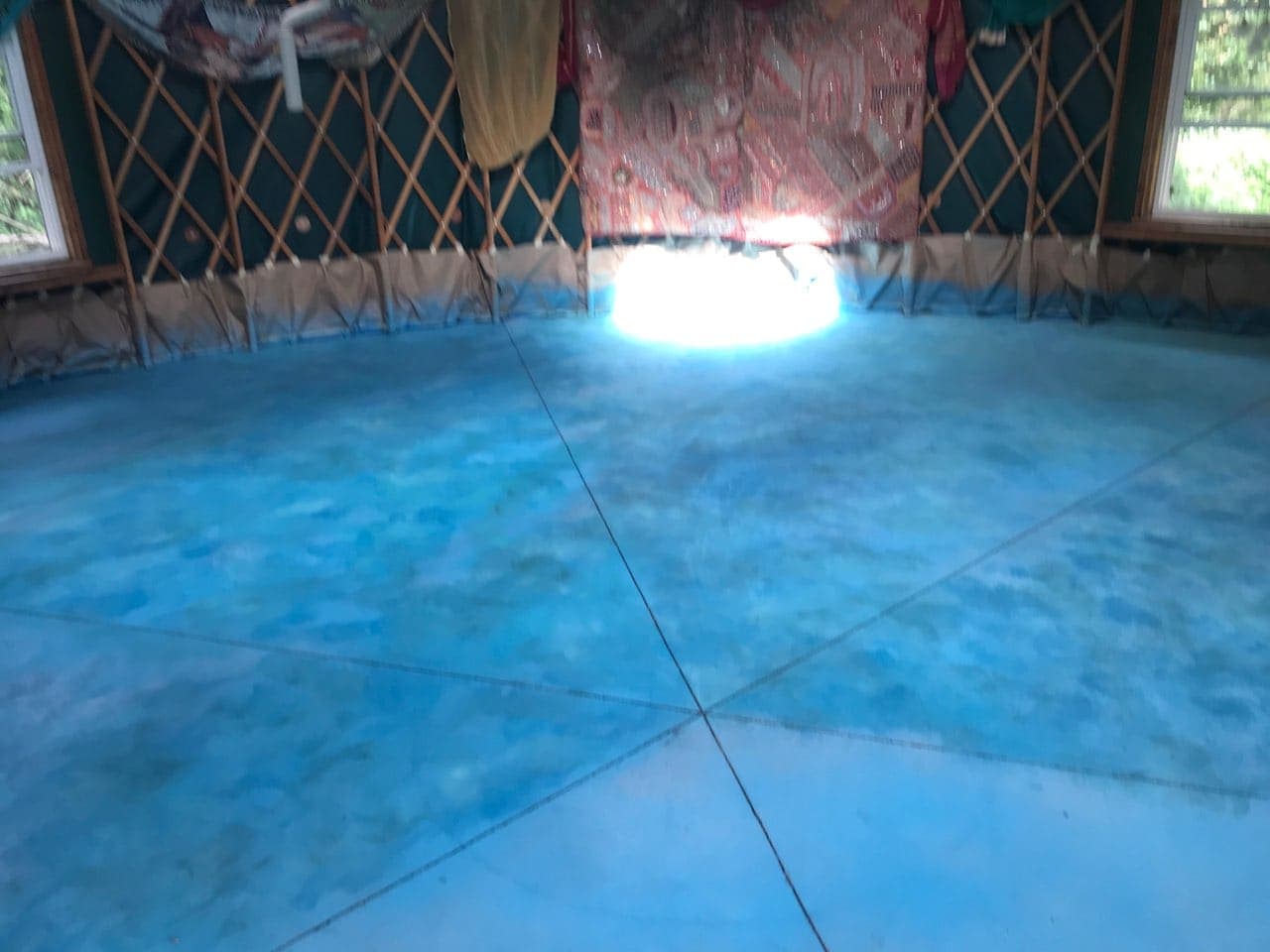 Stained concrete floor inside the Earthsong Foundation yurt